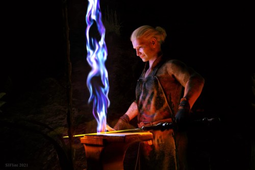 A blacksmith hammers a sword with magical blue wisps above it.